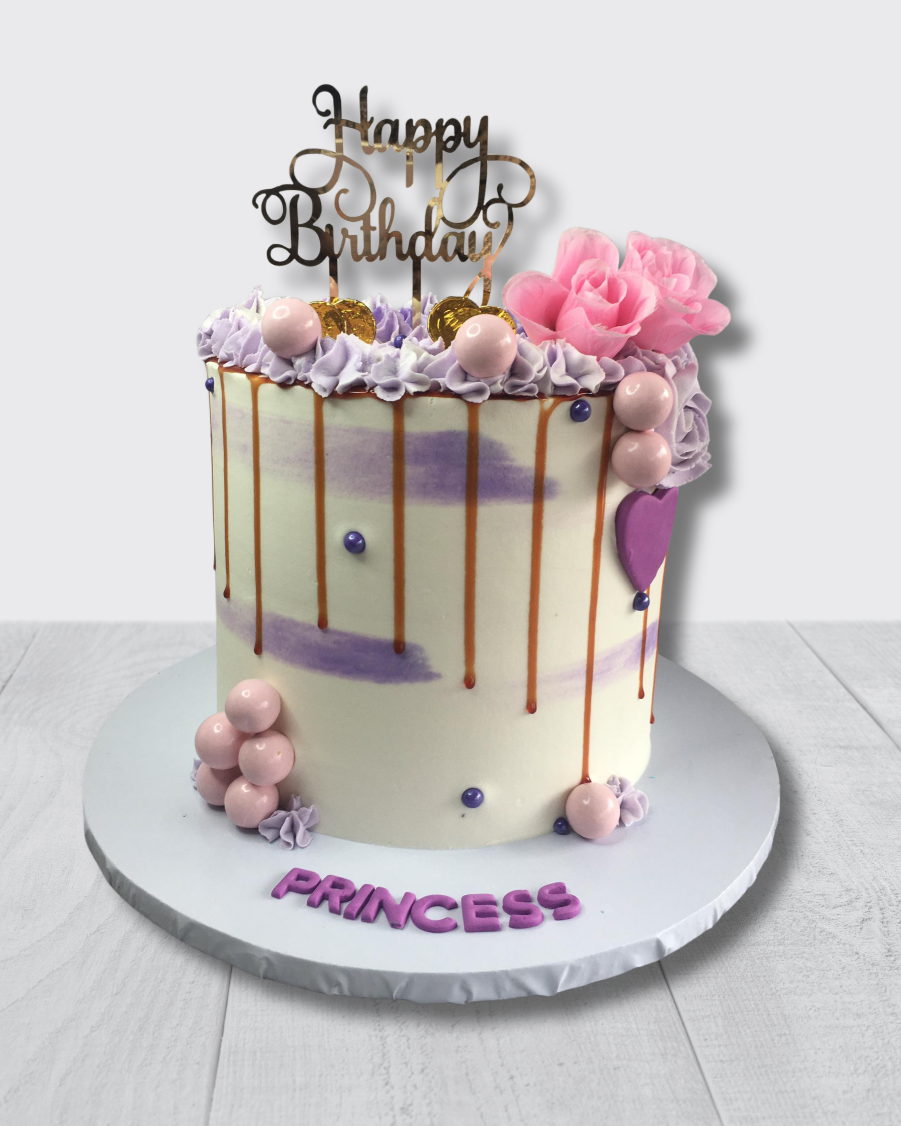 Birthday cake with 'Happy Birthday' topper and 'Princess' text on a white background