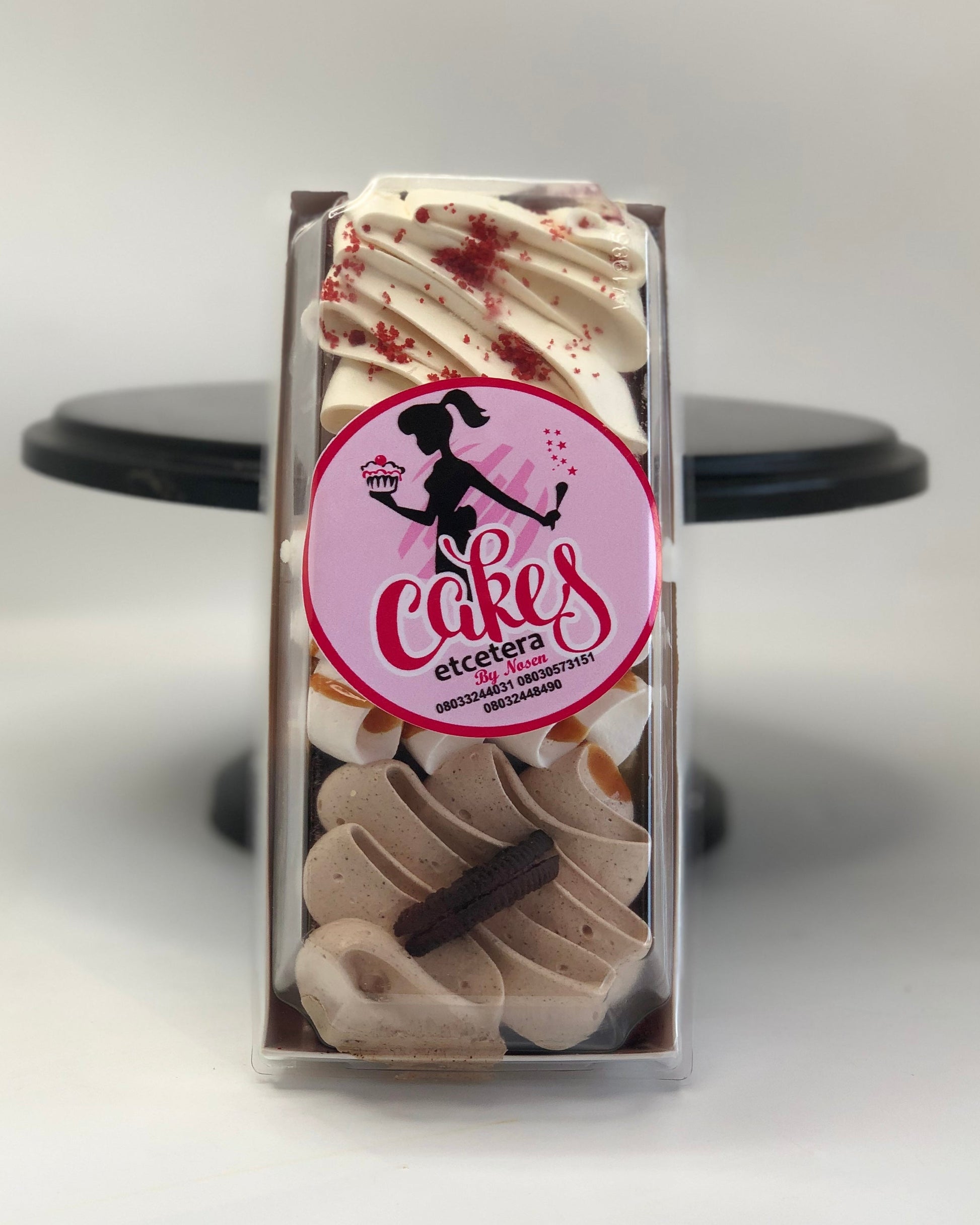 Packaged cake slices with a 'Cakes Etcetera' logo on a white background