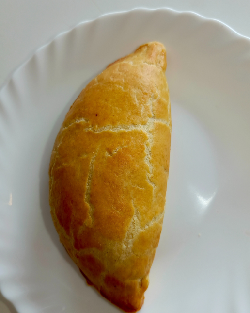 Pastry on a white plate with a plain background
