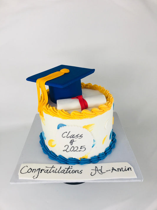 Graduation-themed cake with a blue cap and yellow tassel on a white background